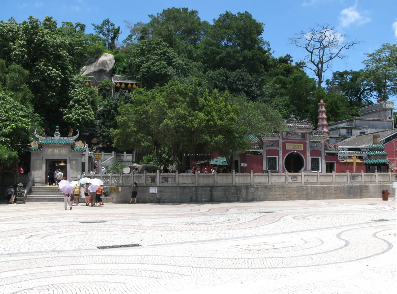 The entrance and wooded hillside setting of A-Ma Temple