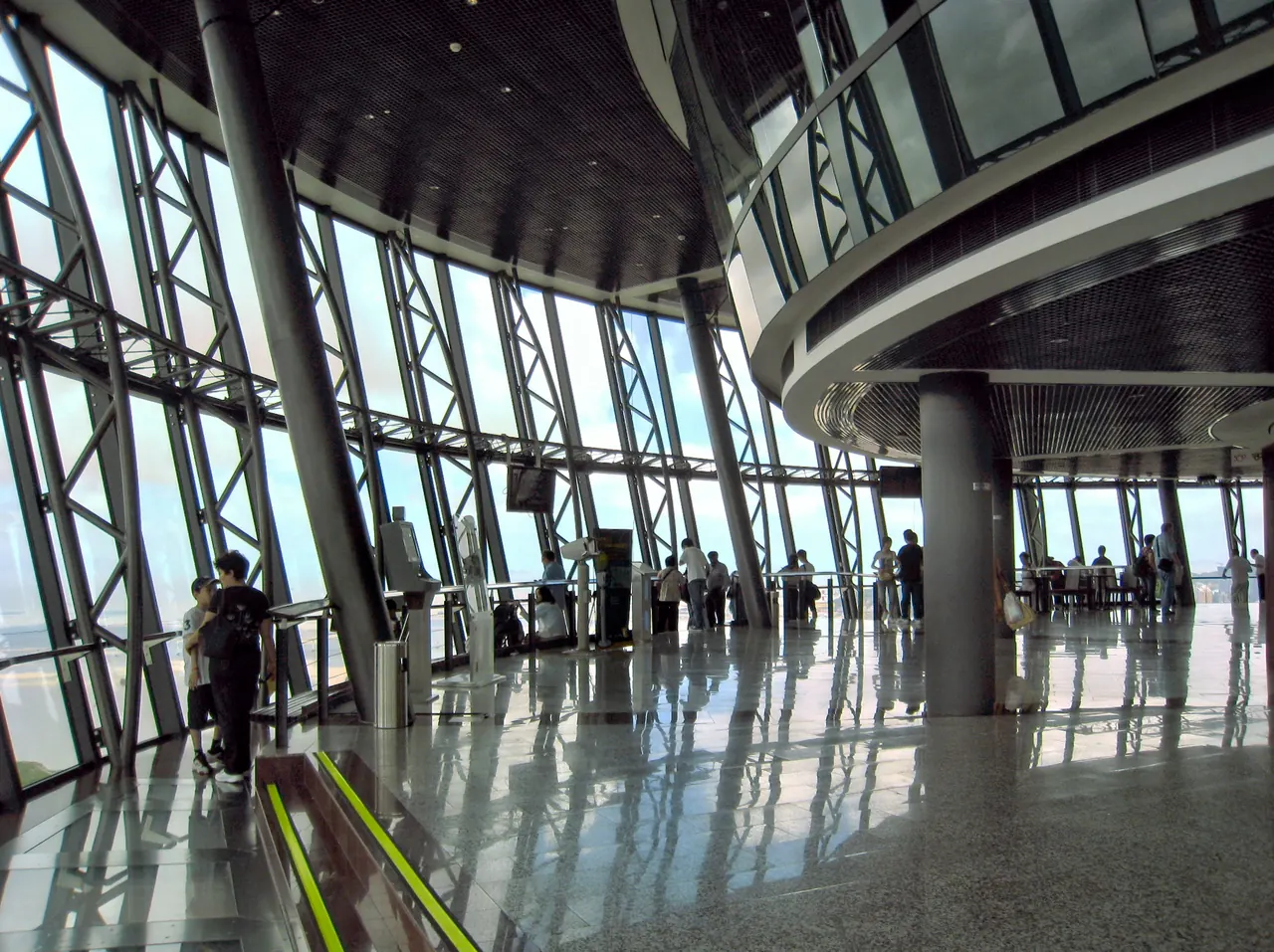 Large windows and interior viewing space on Macau Tower's observation deck