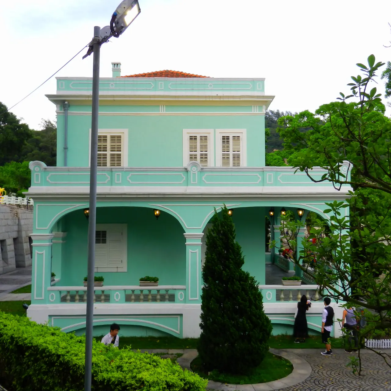 A green-and-white historic residence in the Taipa Houses ensemble