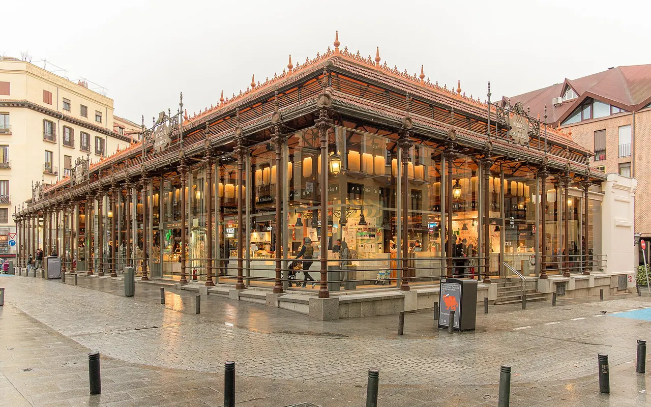 The iron and glass exterior of San Miguel Market beside Madrid's old city
