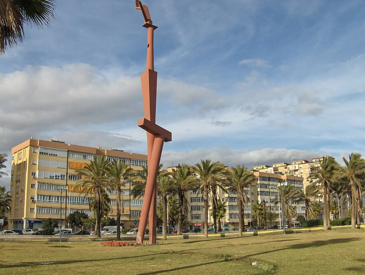 Palms and a sculptural monument in the waterfront neighbourhood of Huelin