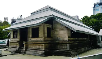The coral-stone walls and tiered roof of Male's Old Friday Mosque