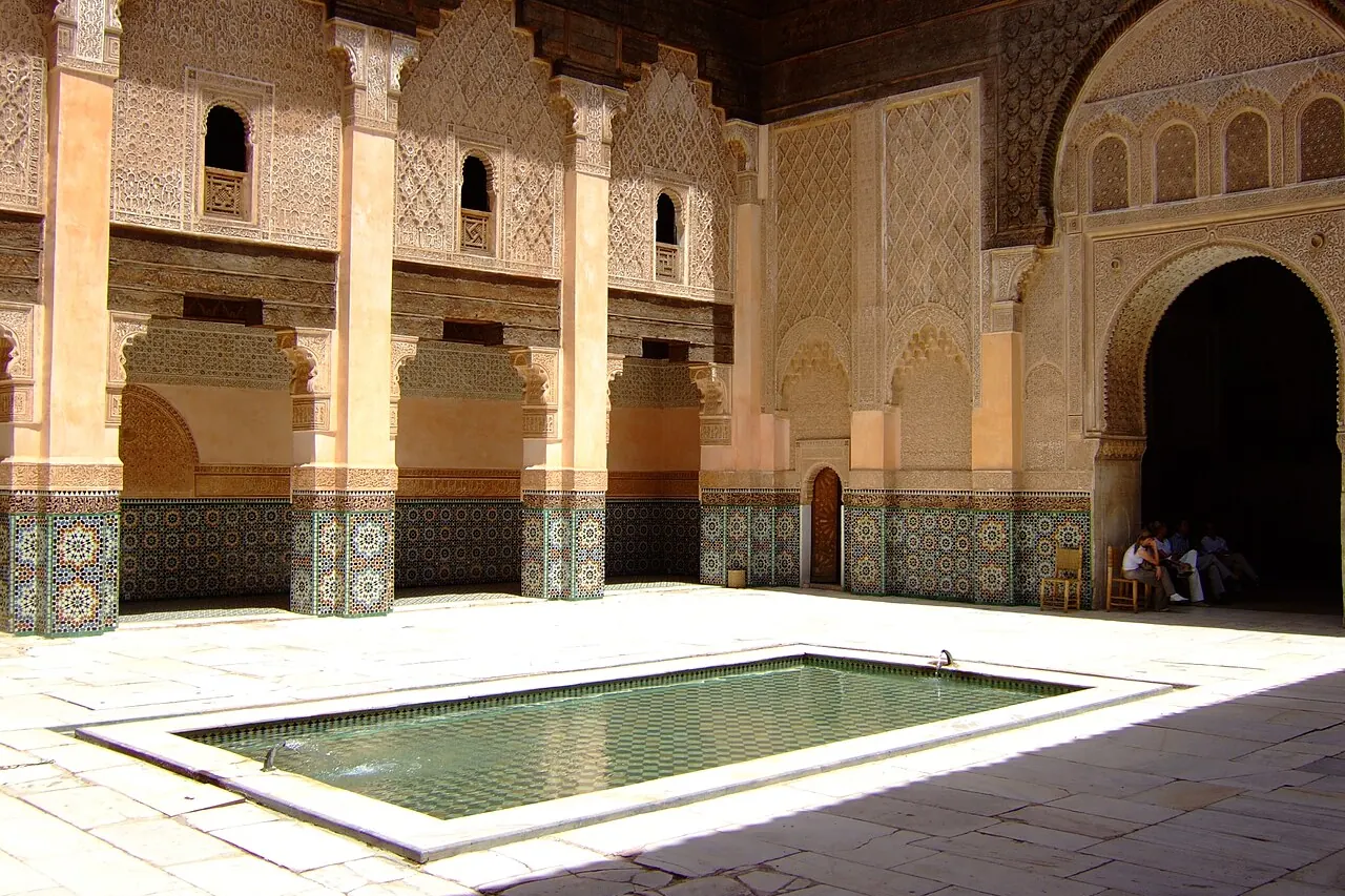 Decorated courtyard and reflecting pool at Ben Youssef Madrasa