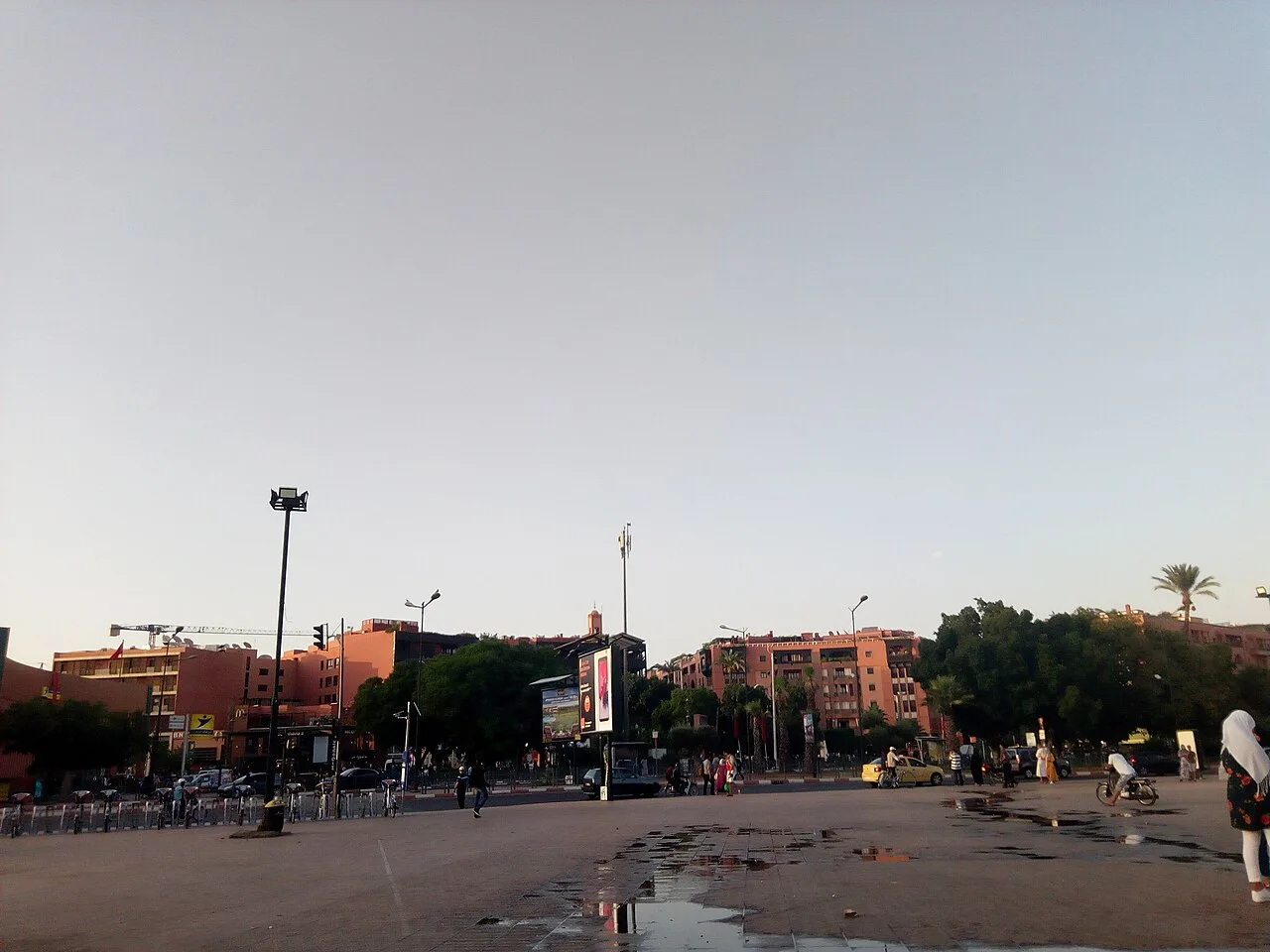 A broad public square, traffic and modern streetscape in Gueliz, Marrakech