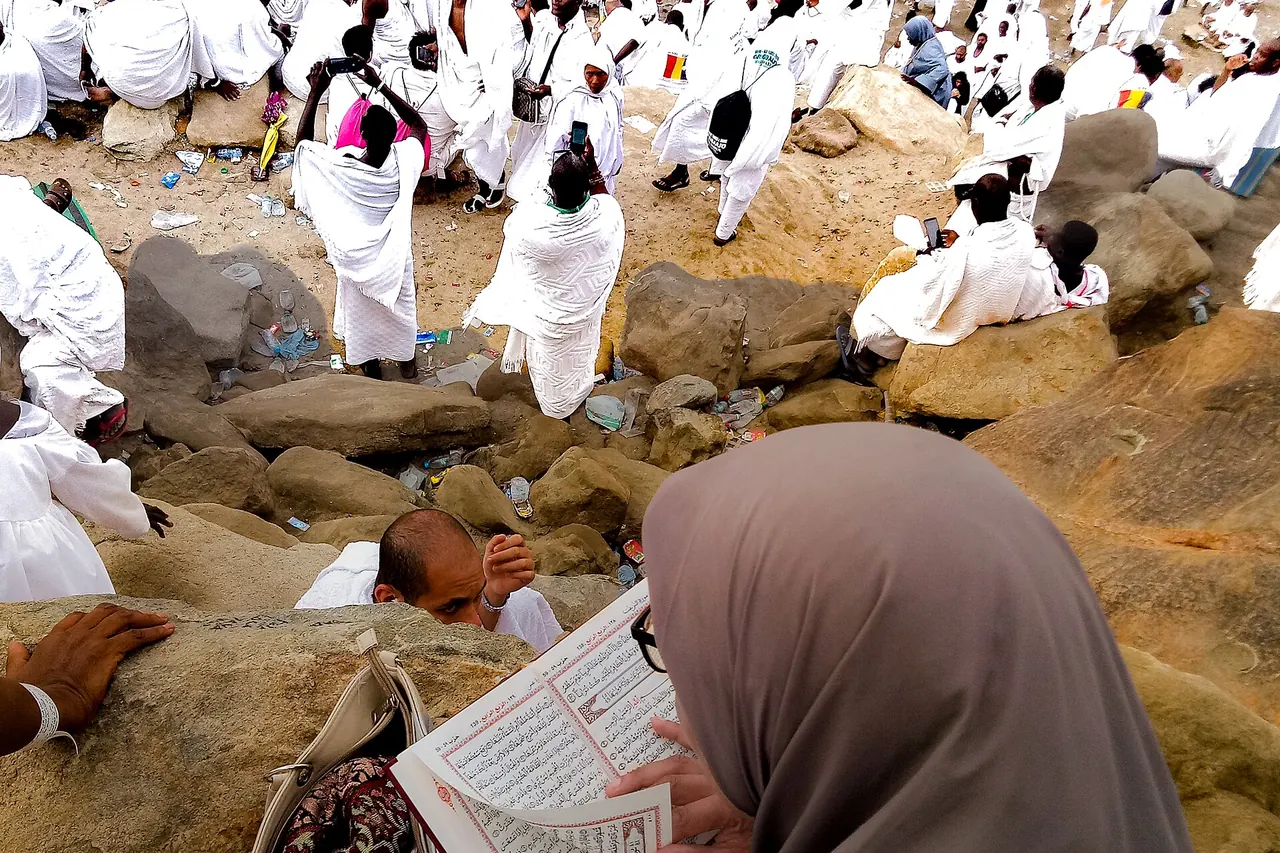Pilgrims gathered on the rocky steps of Jabal al-Rahmah at Arafat