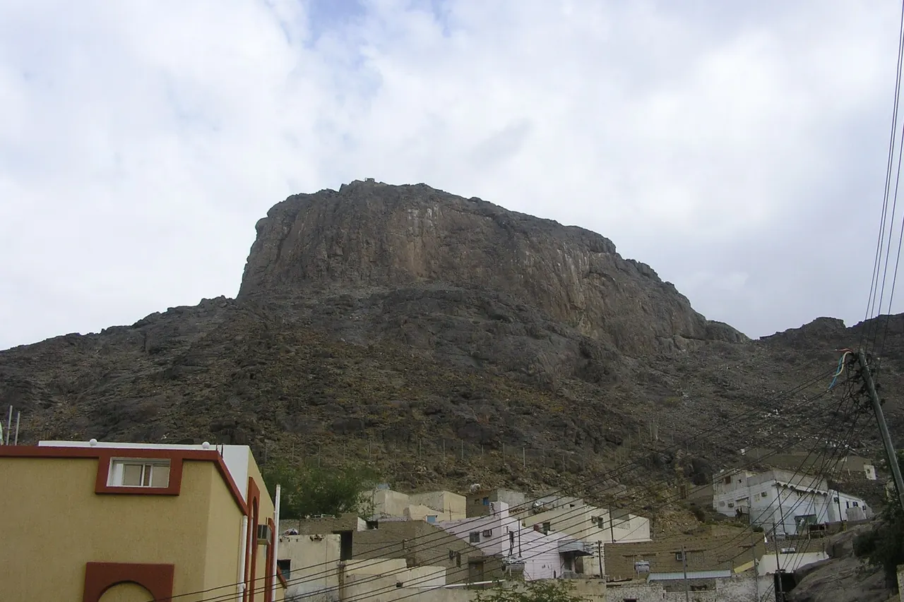 The rocky outline of Jabal al-Nour rising above buildings near its base