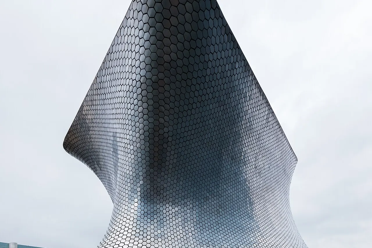 The curved silver facade of Museo Soumaya at Plaza Carso