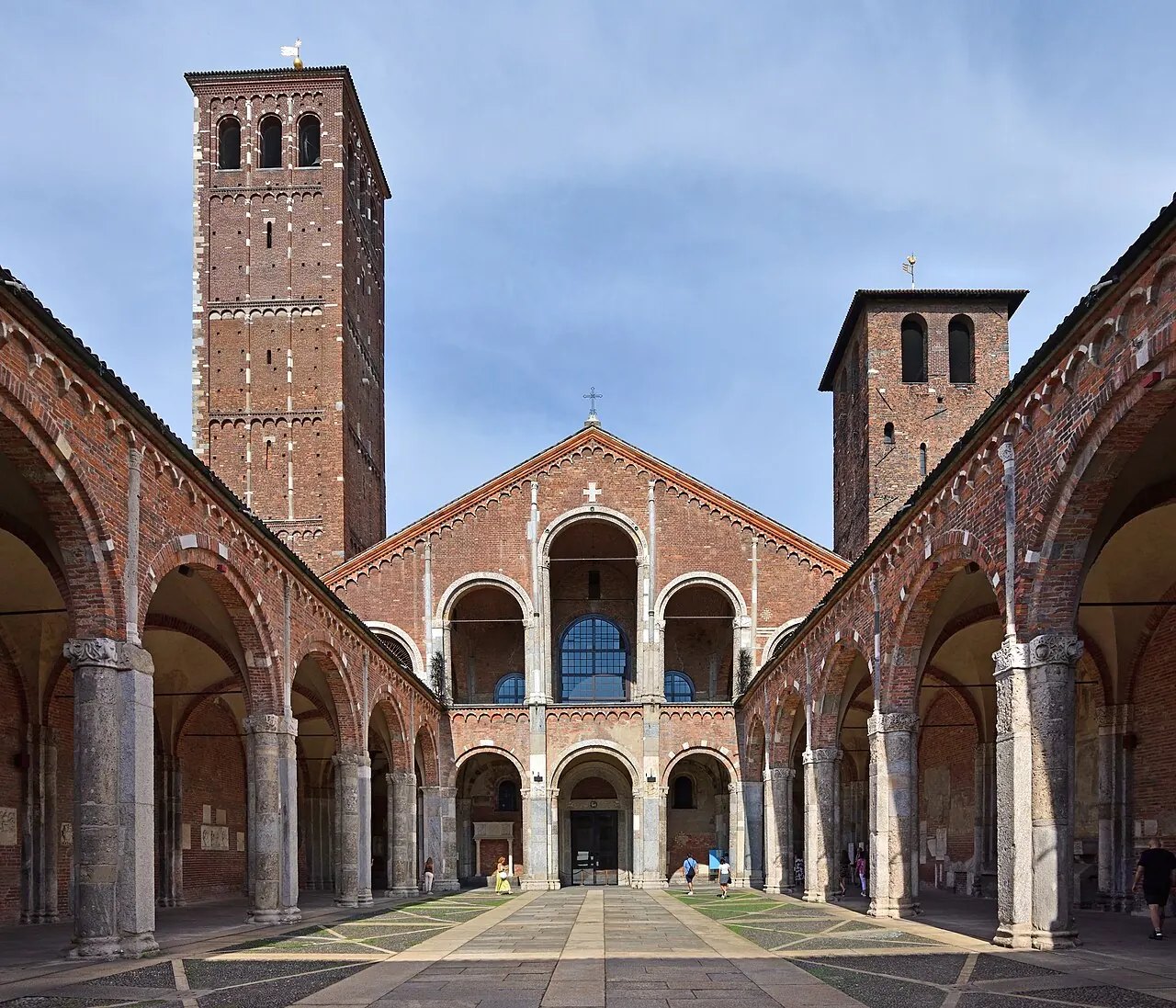 The arcaded atrium and brick facade of the Basilica of Sant'Ambrogio