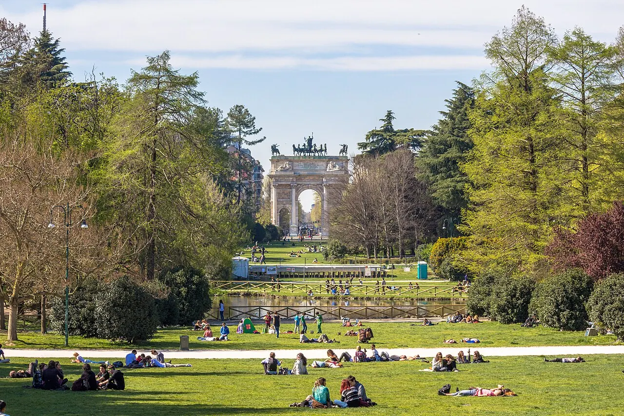 The lawns and paths of Parco Sempione with the Arch of Peace beyond