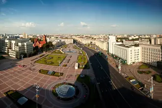 Open paved Independence Square in Minsk with surrounding civic buildings