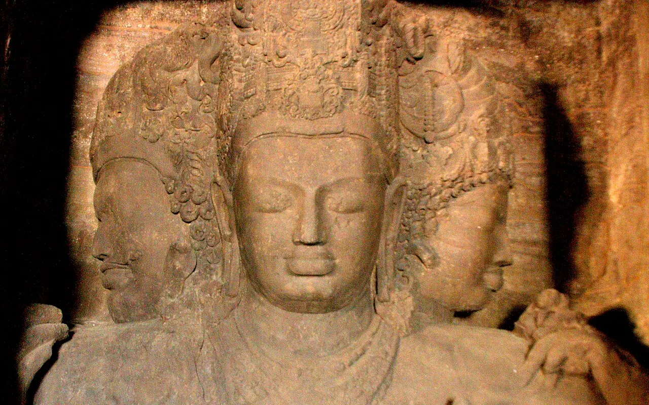 The three-faced Shiva relief inside the rock-cut Elephanta Caves