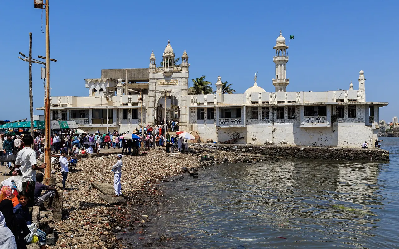 The white domes of Haji Ali Dargah beyond its causeway in the sea