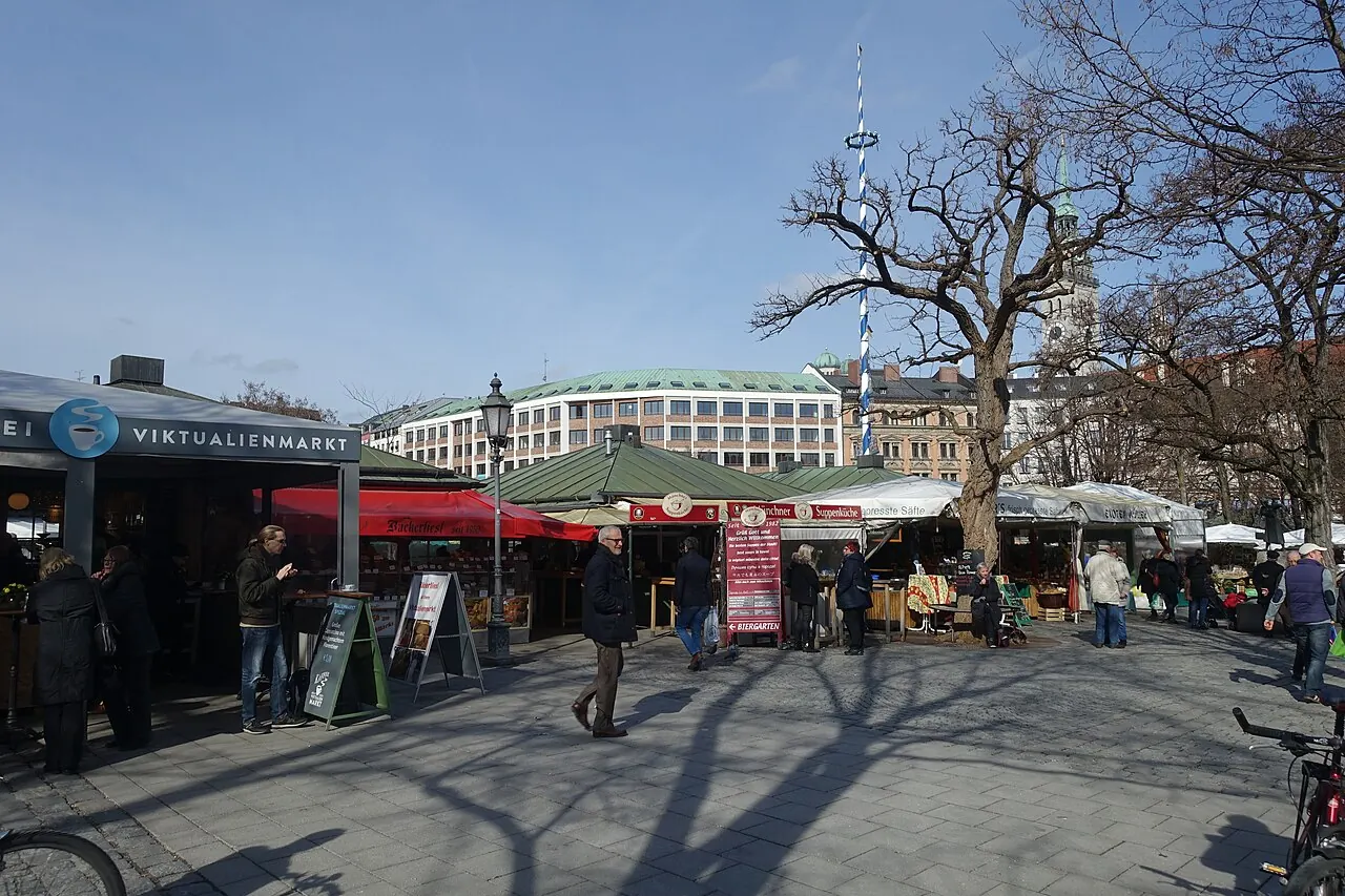 Food stalls, market buildings and the maypole at Munich's Viktualienmarkt