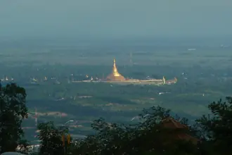 Uppatasanti Pagoda rising above the green landscape of Naypyidaw