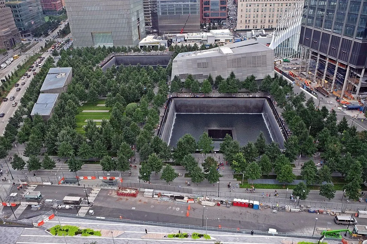 A reflecting pool and surrounding trees at the National September 11 Memorial