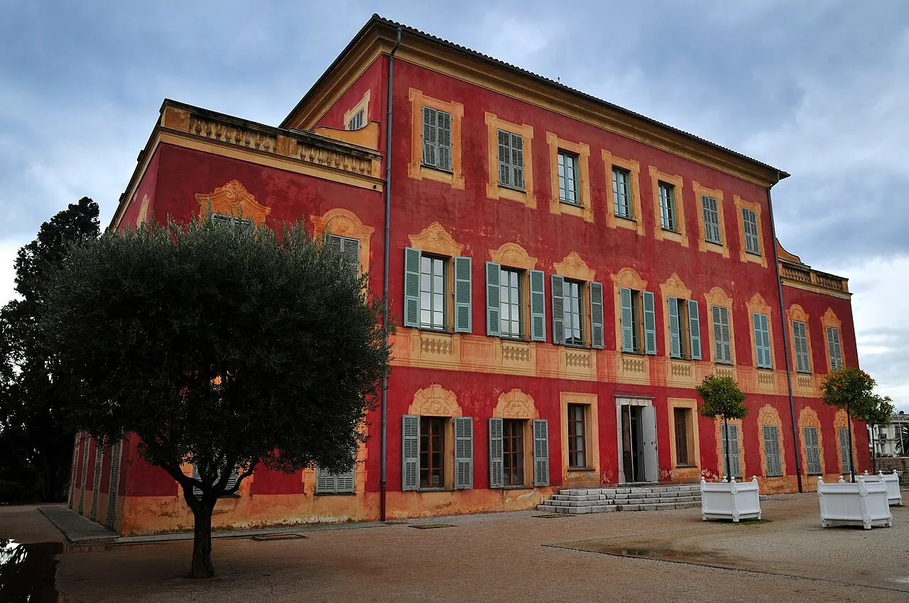 The red villa housing the Matisse Museum among trees in Cimiez