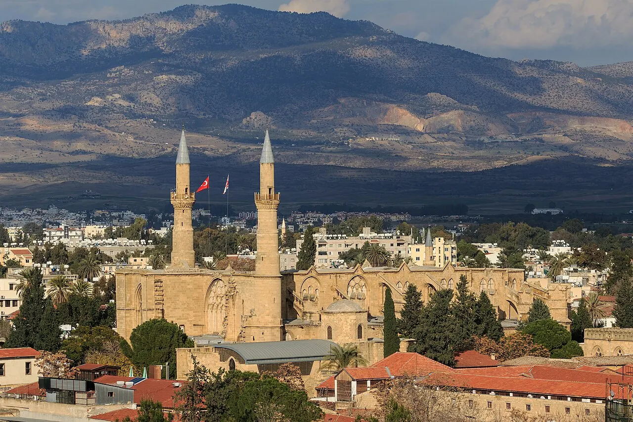 The Gothic body and two minarets of Selimiye Mosque above northern Nicosia rooftops