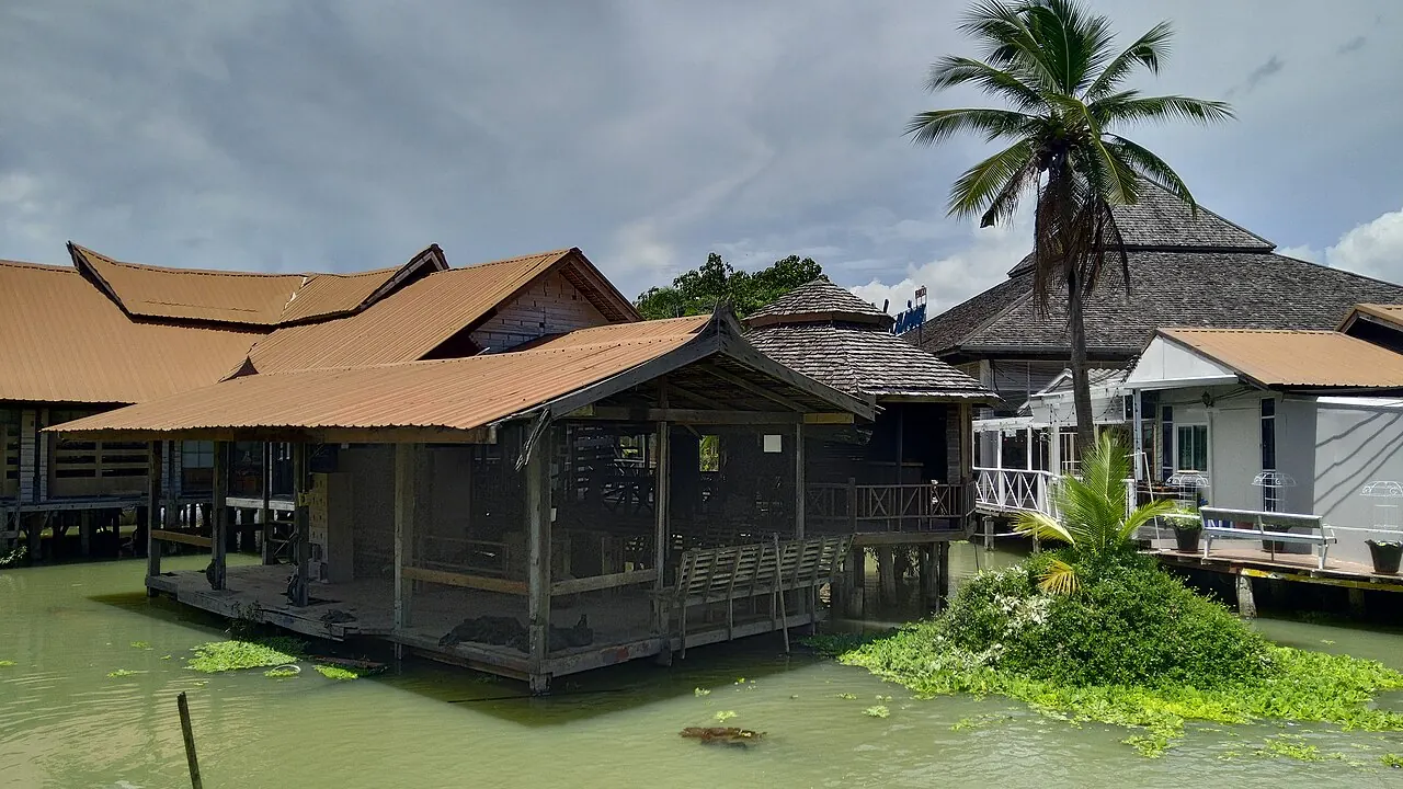 Wooden market structures beside waterways at Pattaya Floating Market