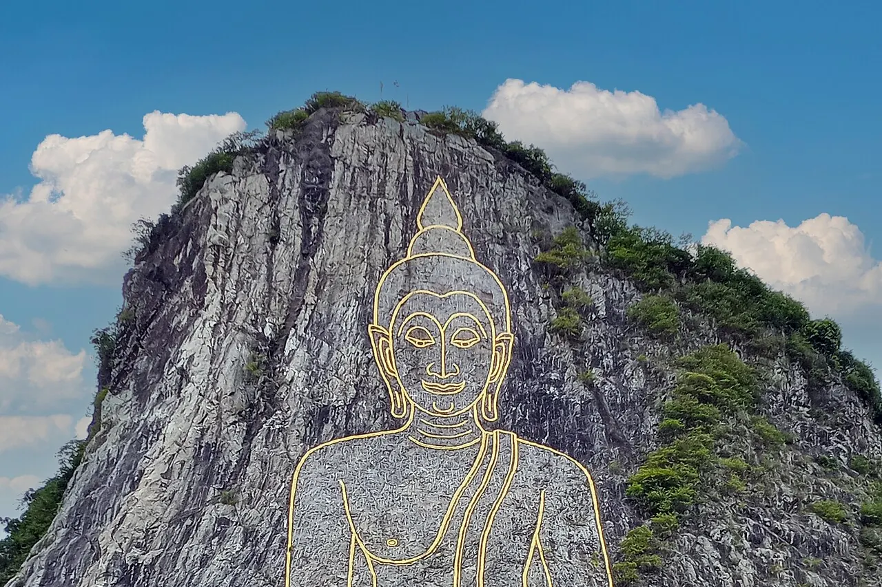 The outlined Buddha image on the limestone cliff at Khao Chi Chan