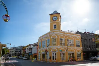 The yellow clock-tower building and colourful shophouses in Phuket Old Town