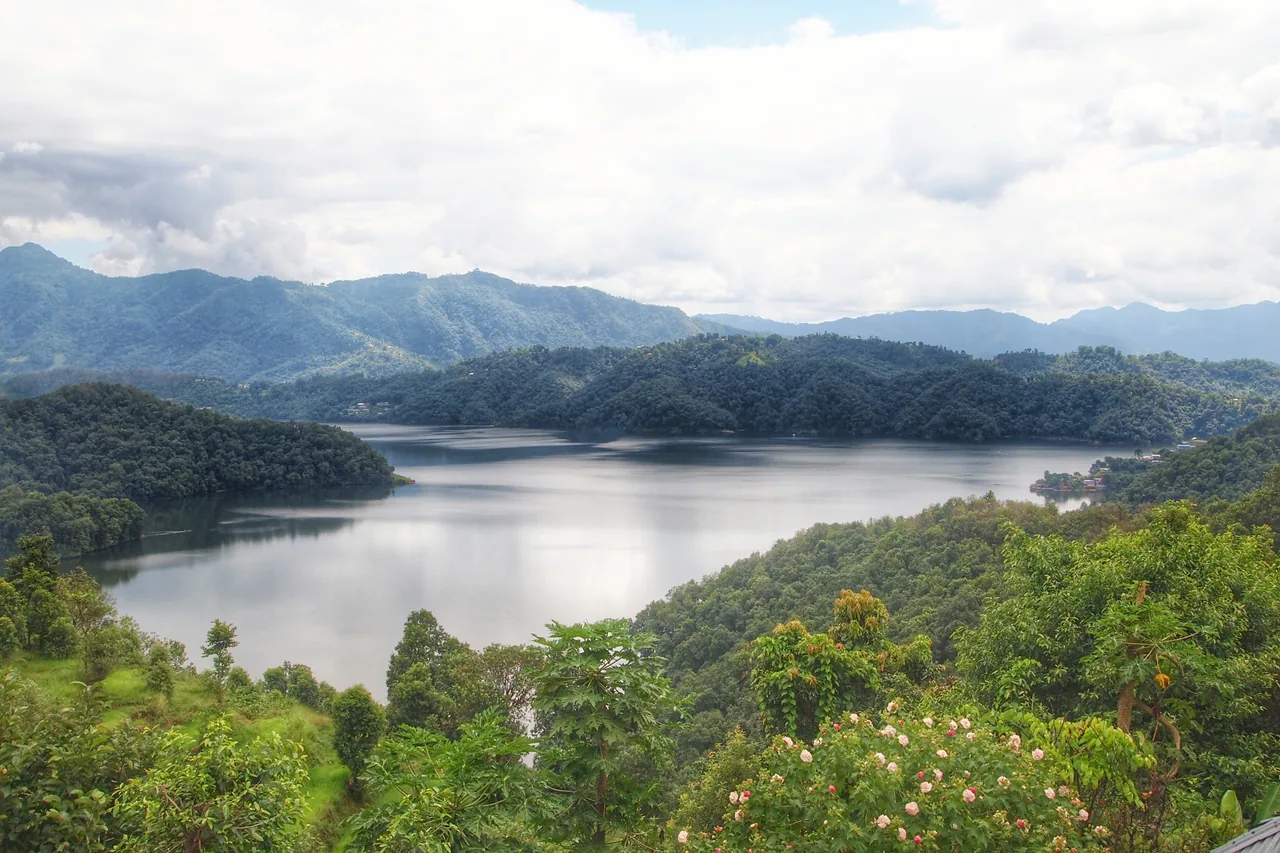 Begnas Lake and the green hills around its shore