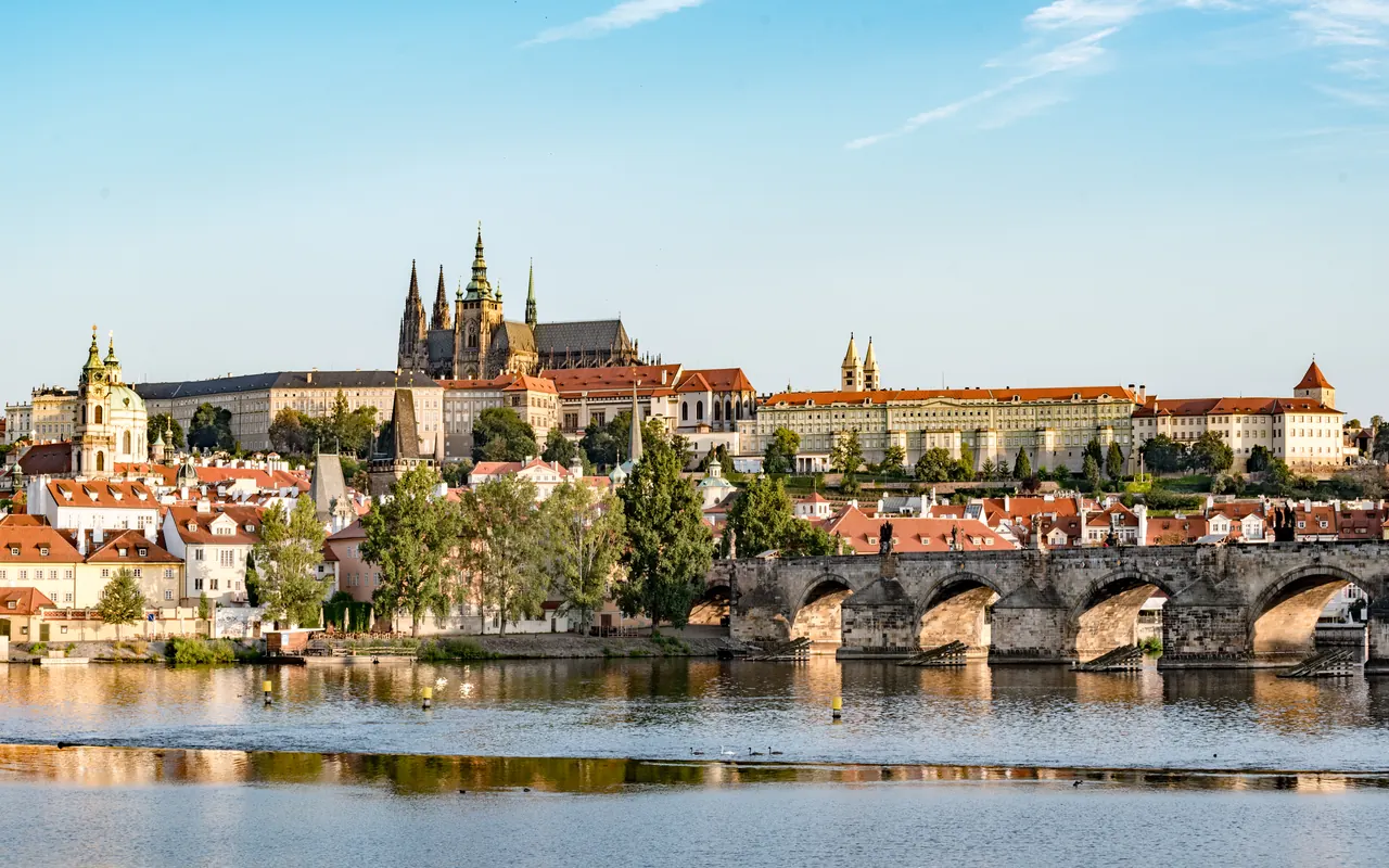Prague Castle extending across the hill above the Vltava and Charles Bridge