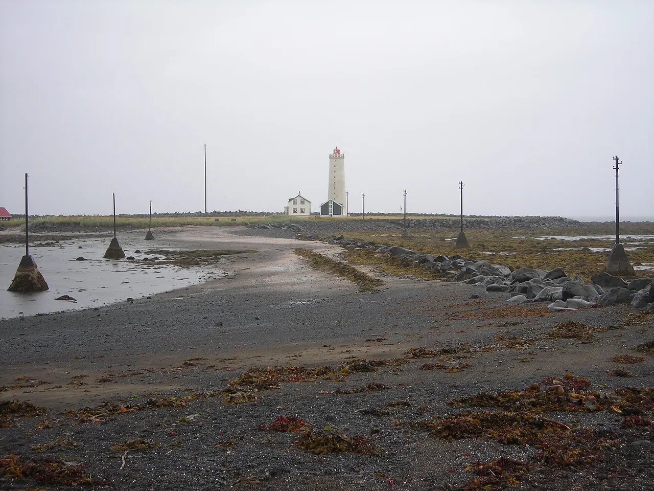 Grotta lighthouse beyond the tidal shore at Seltjarnarnes near Reykjavik