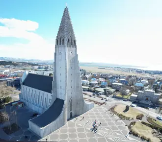 Hallgrimskirkja church and tower above the rooftops of Reykjavik