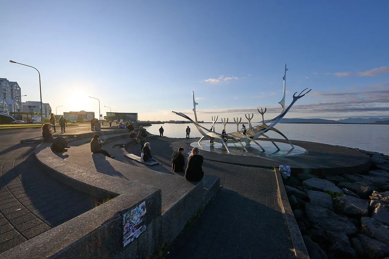 The Sun Voyager steel sculpture beside the sea in Reykjavik at sunset
