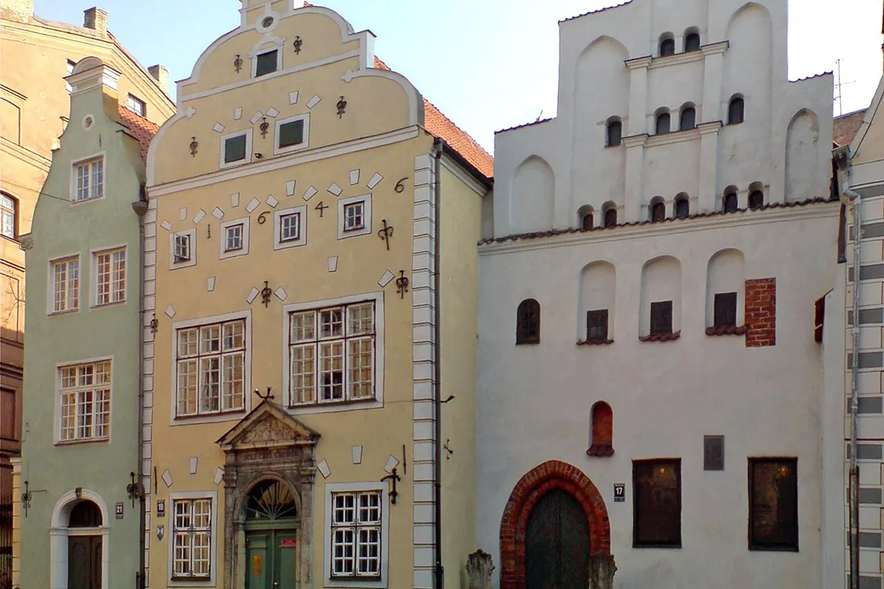 Three historic adjoining houses with differently shaped facades in Riga