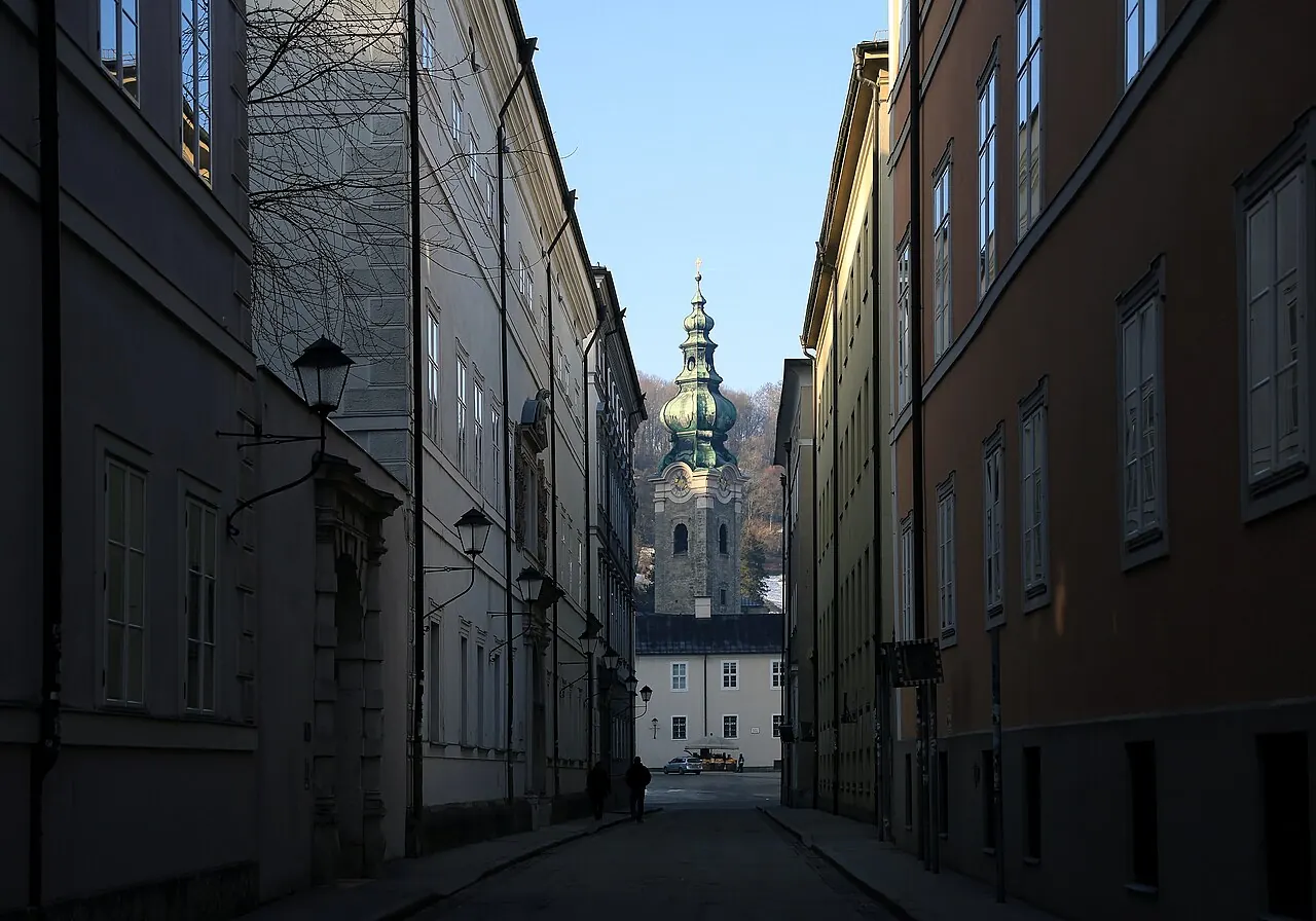 View along Kapitelgasse towards St Peter’s Abbey church in Salzburg