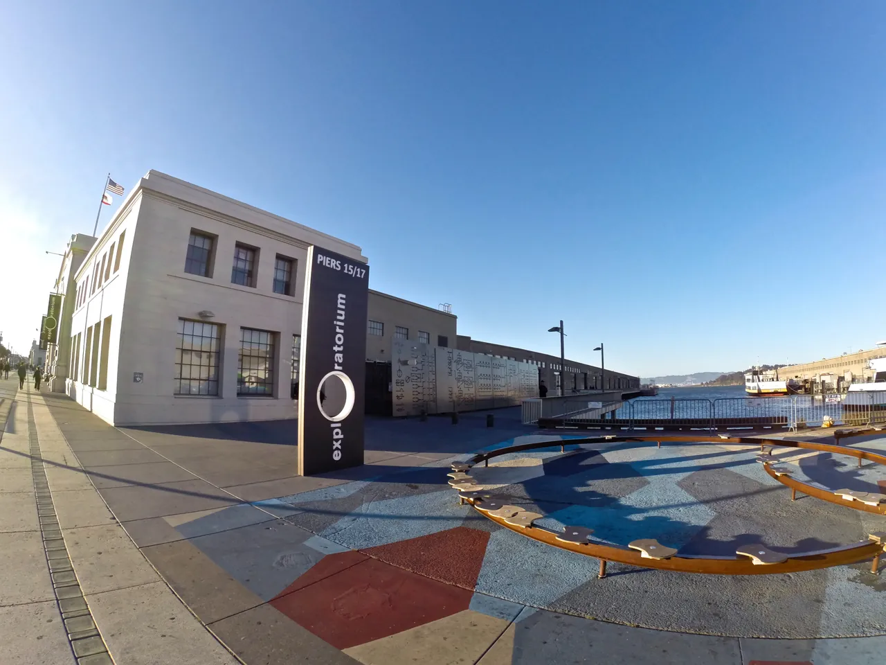 Exploratorium entrance sign and waterfront building beside Piers 15 and 17