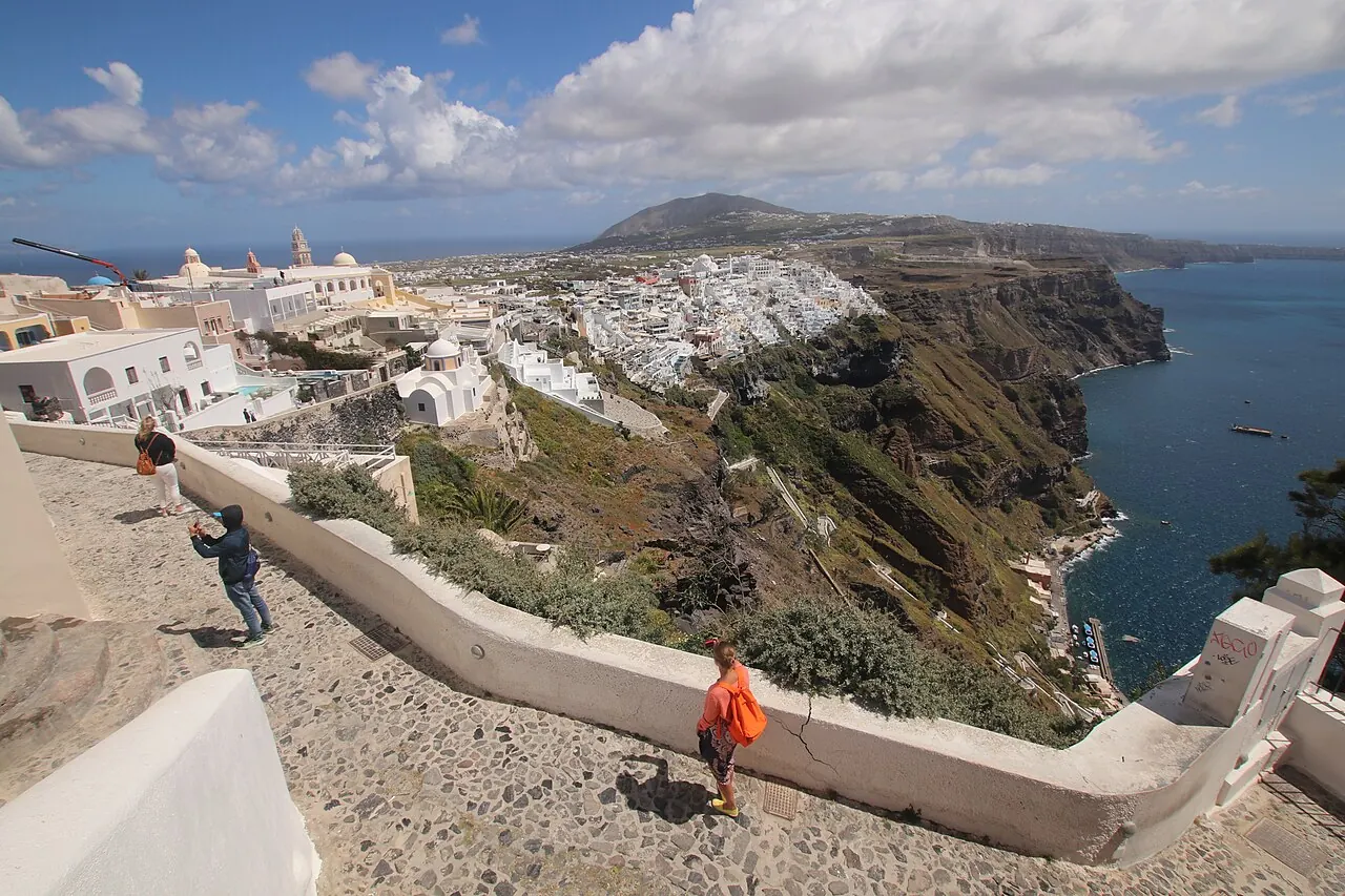 Fira's white hillside buildings above the caldera, with the sea beyond