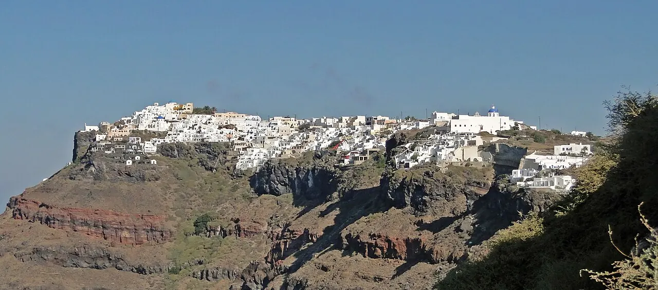 Imerovigli's buildings perched along the caldera rim above Santorini's steep slopes