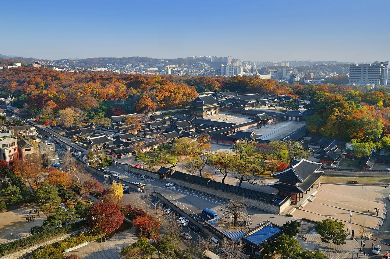 Palace roofs, courtyards and wooded surroundings at Changdeokgung