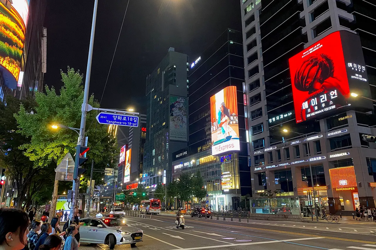 Evening shops and street traffic near Hongik University station in Hongdae