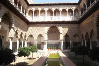 Arcaded courtyard and reflecting pool in the Real Alcazar of Seville