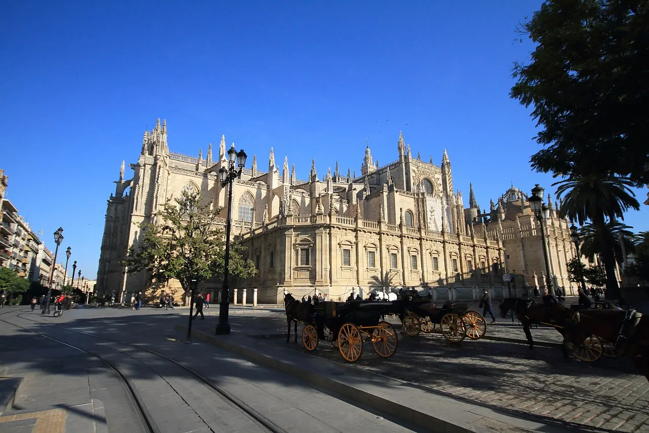 Seville Cathedral and its Giralda bell tower above the surrounding streets