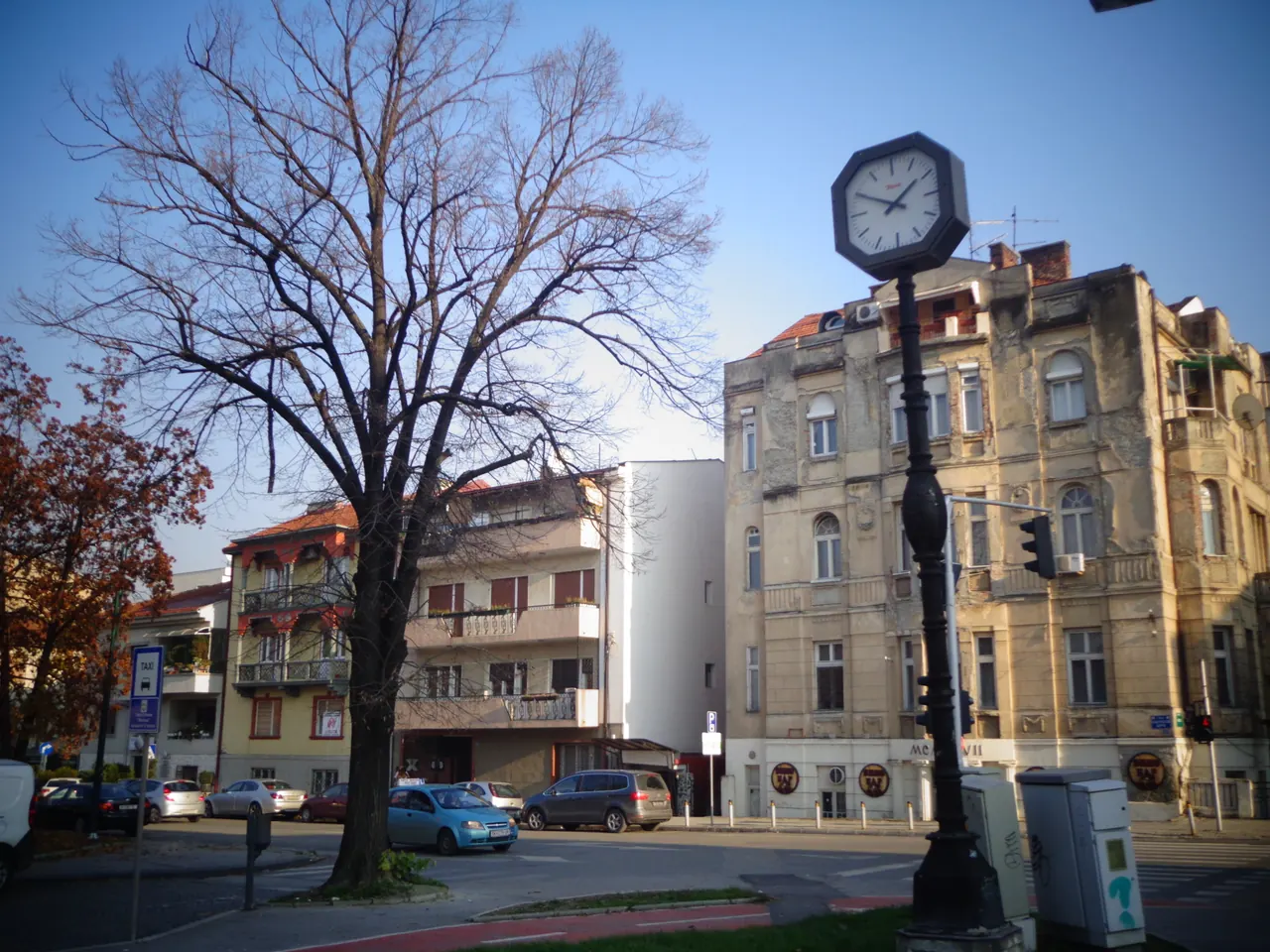 Historic street-front buildings and clock on Ilindenska in Debar Maalo