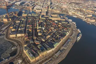 Historic waterfront buildings and church spires in Stockholm's Gamla Stan