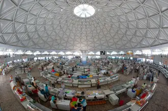 Produce stalls beneath the patterned dome of Chorsu Bazaar