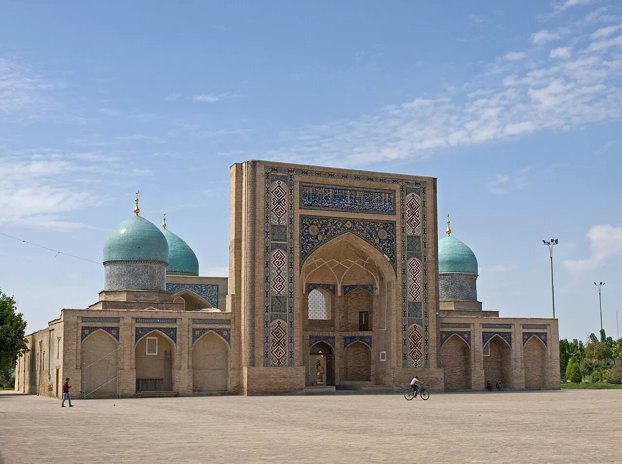 The tiled portal and domes of Barak Khan Madrasah in the Hazrati Imam complex