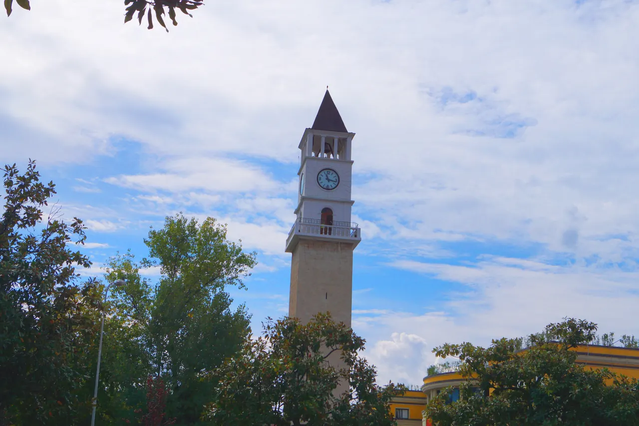 Tirana Clock Tower rising beside the low buildings on Skanderbeg Square