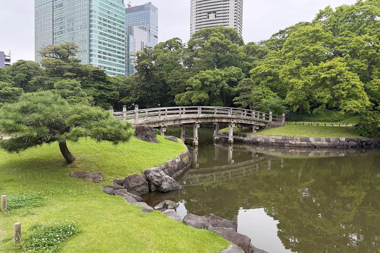 A stone bridge crossing the pond in Hamarikyu Gardens