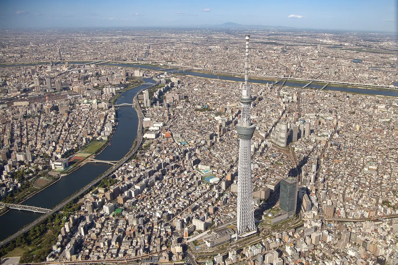 Tokyo Skytree rising above the surrounding city in an aerial view