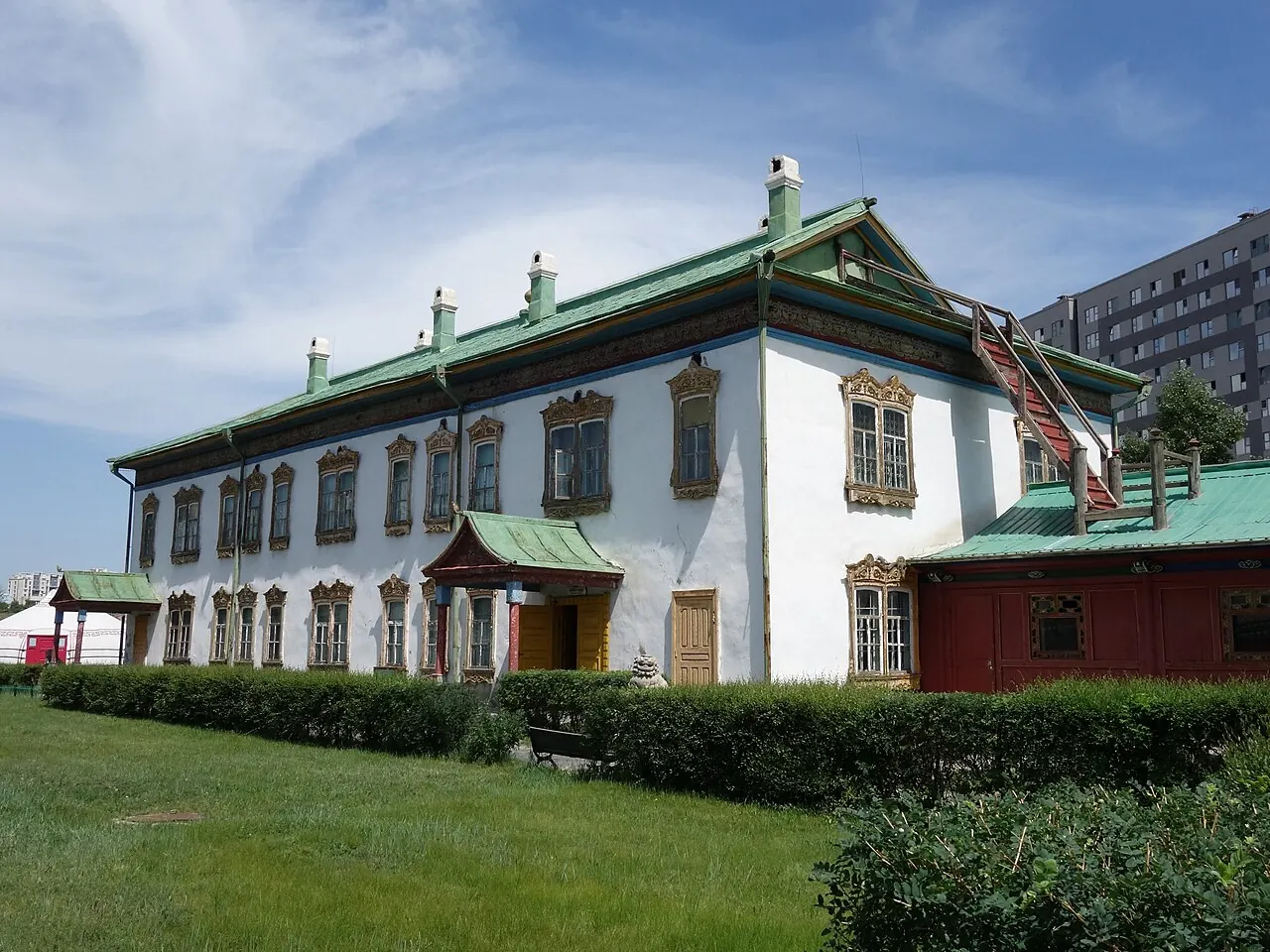 The pale Winter Palace building with its green roof at Bogd Khaan Palace Museum