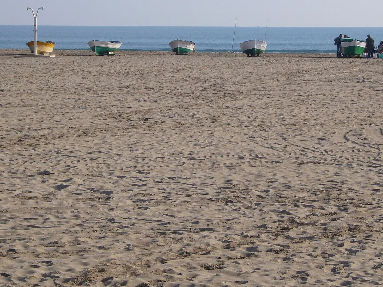The broad sand and beach boats at Malvarrosa in Valencia