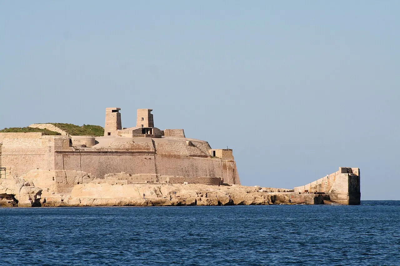 Fort St Elmo’s long waterfront walls viewed across the sea in Valletta