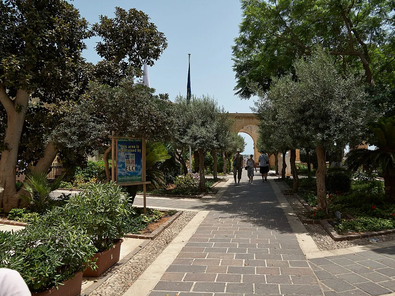 Paved walkway, planting and stone arcade in Upper Barrakka Gardens, Valletta