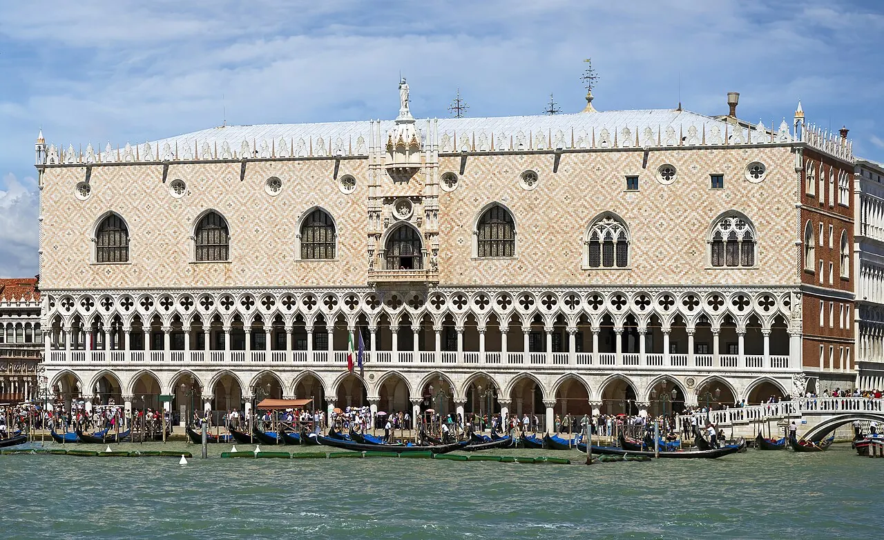 The Gothic arcades and patterned exterior of the Doge's Palace facing the lagoon